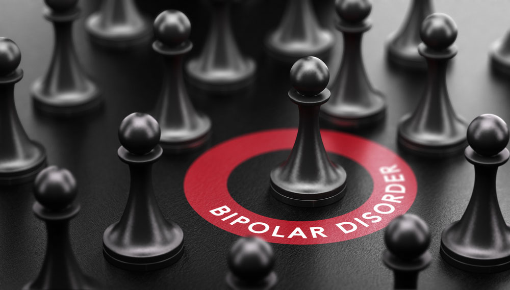 3d illustration of pawns over black background and a red circle with the text bipolar disorder.